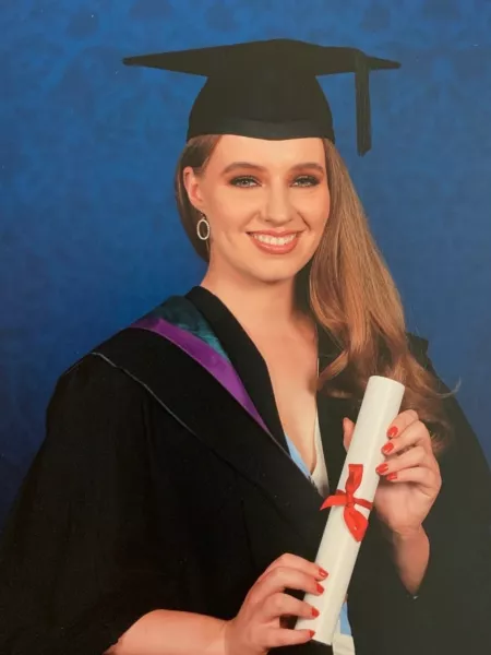 young girl in a graduation outfit