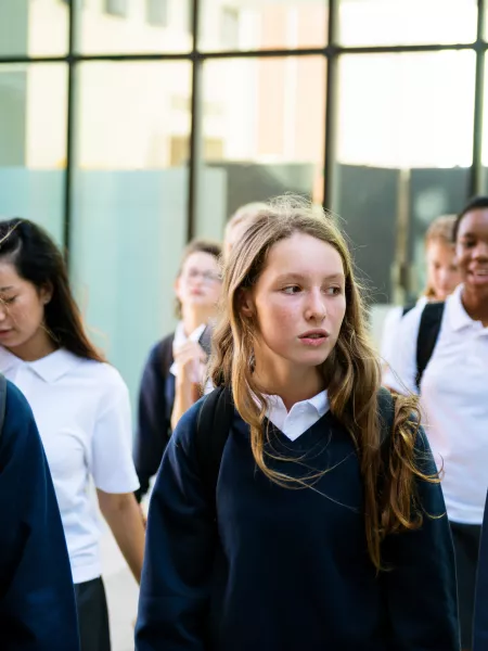 Group of young people in a corridor at secondary school