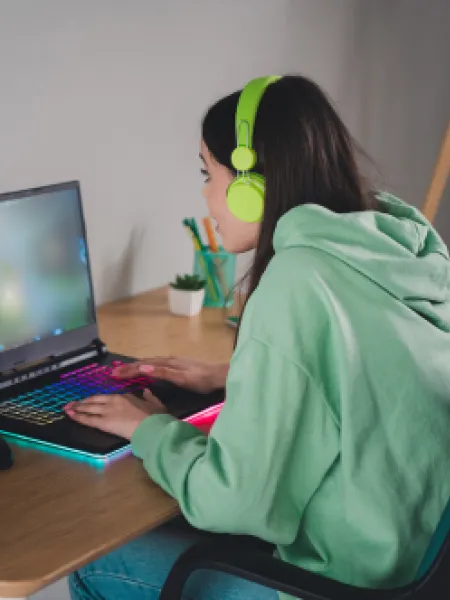 Young girl on her laptop for a Youth Virtual Group