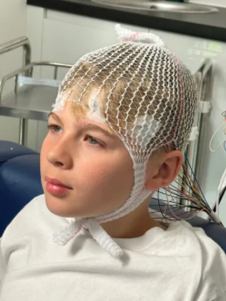 Young boy preparing for an EEG