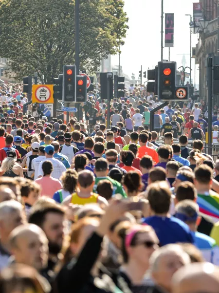 Dozens of runners crowd a street in Leeds.