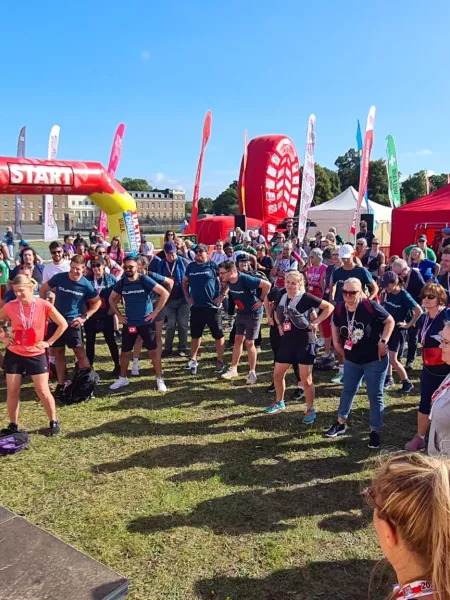A group of runners gather before their summer event.