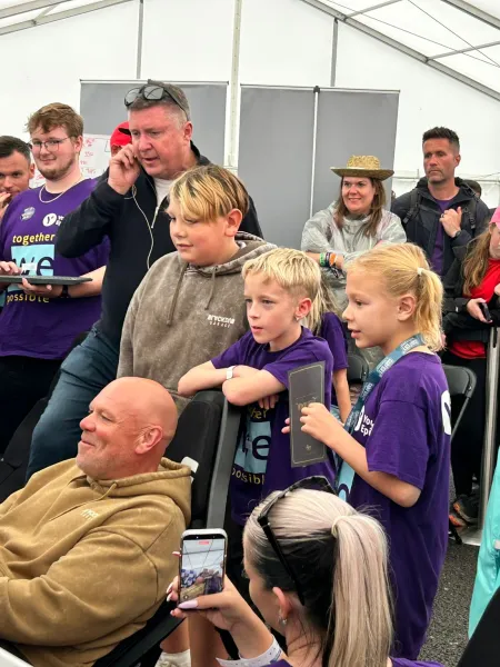 A group gathers for Purple Day.